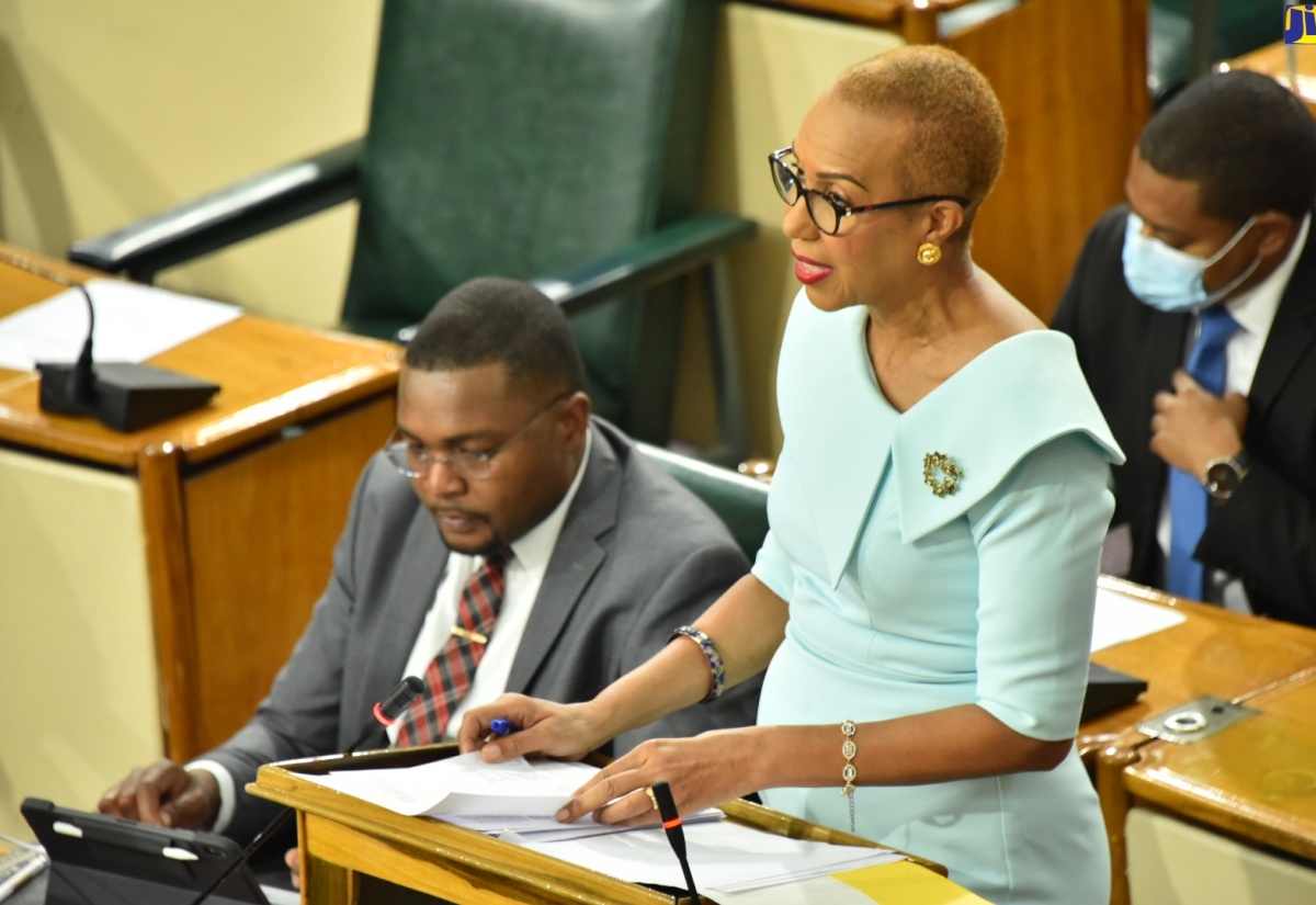 Education and Youth, Hon. Fayval Williams, makes her contribution to the 2022/23 Sectoral Debate in the House of Representatives, on April 12. At left is Minister without Portfolio in the Office of the Prime Minister with responsibility for Information, Hon. Robert Morgan.